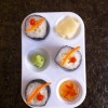 Veggie rolls and condiments in art painting tray