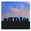 Stonehenge silhouette with rainbow sky